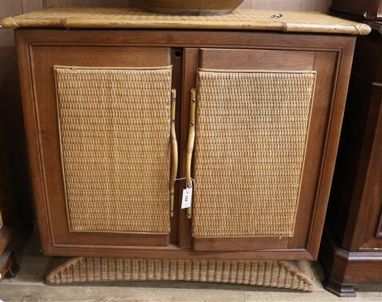 A teak and rattan side cabinet W.105cm